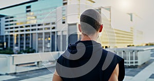 Back, fitness and man thinking in city for running, cardio workout or endurance training. Lens flare, sports and athlete