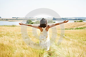 Back, freedom and woman with open arms at field in the countryside outdoor in summer mockup. Rear view, person in nature