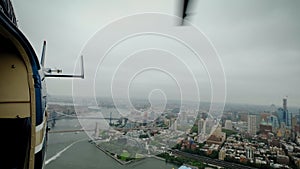 The back of a helicopter flying over the metropolis of Manhattan Financial District, New York, USA