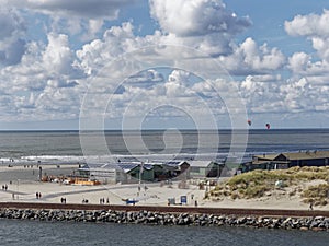 The back of Ijmuiden beach with People walking, cycling