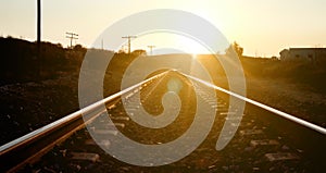 Back-lit railroad landscape in perspective