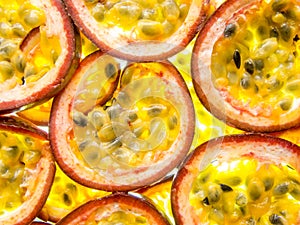 Back lit slices of ripe maracuja passion fruit