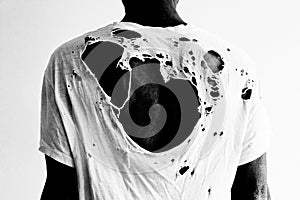 Back of a man with ripped white t-shirt