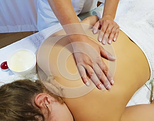Back massage beautiful girl salon therapist attractive wellbeing relaxation healthcare professional healthy spa procedure