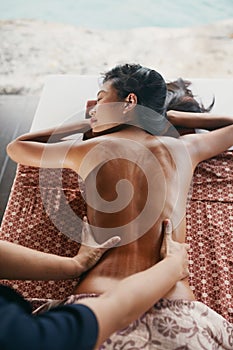 Back Massage At Thai Spa. Woman Having Body Massage At Salon