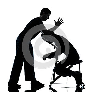 Back massage therapy with chair silhouette