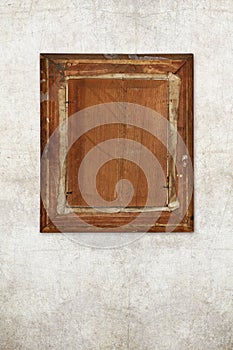 Back of old wooden picture frame on old wall