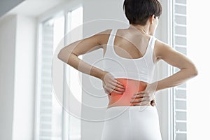 Back Pain. Closeup Of Woman Body With Pain In Back, Backache photo