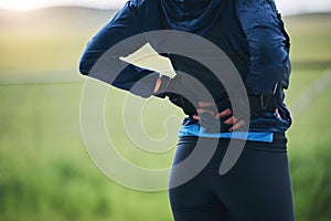 Back pain, fitness and sports woman outdoor with scoliosis, health risk and burnout from marathon. Closeup female
