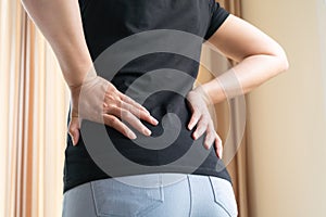 Back pain at home. women suffer from backache. healthcare and medical concept