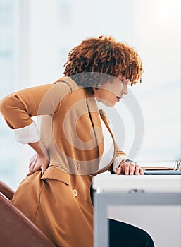 Back pain, injury and black woman in office at desk with spine problem, backache and muscle tension. Stress, medical