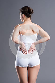 Back pain, kidney inflammation, ache in woman`s body