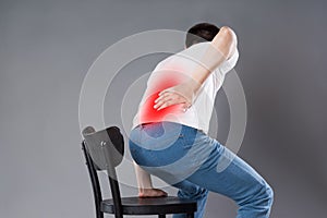 Back pain, kidney inflammation, man suffering from backache