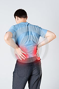 Back pain, kidney inflammation, man suffering from backache