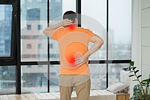 Back pain, man with backache at home