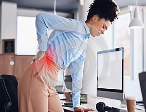Back pain, office and business black woman with injury, muscle ache and spine problem standing at desk. Medical