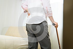 Back pain old woman suffer at home, healthcare problem of senior concept