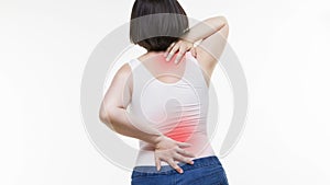 Back pain, woman with backache on white background