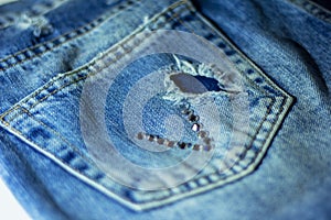 Back pocket of my jeans with applique strass in the form of hew V