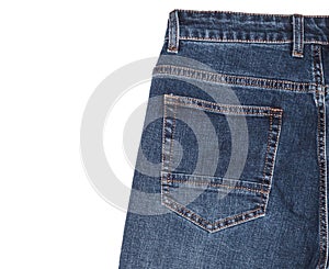 Back pocket and waist area of dark blue jeans isolated on white background. Close up shot. Copy space. Clothing concept