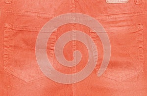 Back pockets of orange trousers