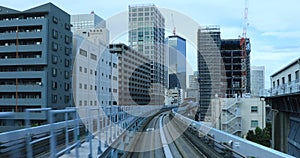 A back point of view on the railway at Yurikamome line in Tokyo