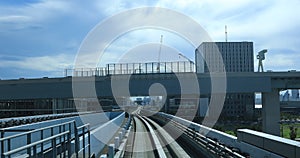 A back point of view on the railway at Yurikamome line in Tokyo