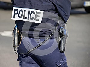 Back of the police officer with the inscription