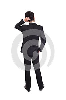 Back pose of a business person thinking