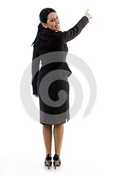 Back pose of businesswoman indicating