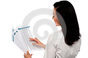 Back pose of businesswoman reading reports photo