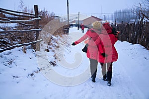 Back profile of two girls in snow