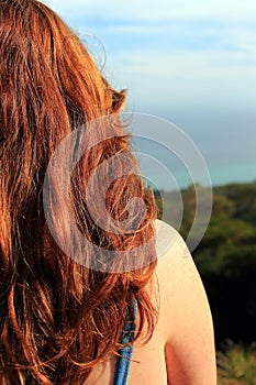 Back of a red-haired woman's head.