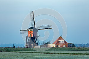 The back of the Red Mill in the grasslands of the South Holland villag of Oud Ade