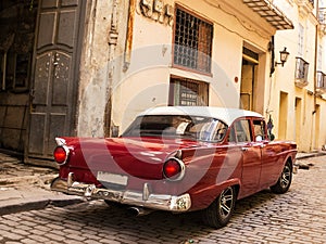 Back Red old and classical car in road of old Havana Cuba