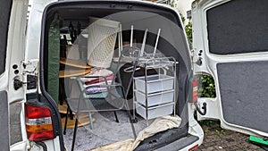 The back of a removals van filled with home furniture from a house clearance