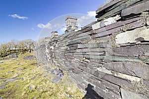 Back of a row of miniature slate lodges known as the Anglesey Barracks at Dinorwic Quarry, Llanberis, North Wales