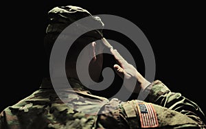 Back, salute and army with a soldier in uniform on a dark background in studio for service or duty as a patriot