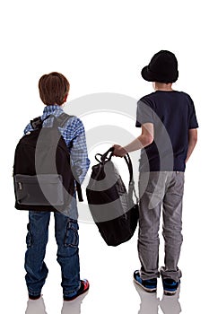 Back of schoolboy holding backpack