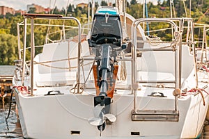 Back shot of boat with outboard engine. Ship propeller.