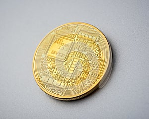 Back side of Bitcoin coin on brushed aluminium background
