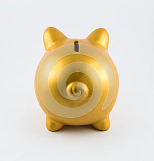 Back side of piggy bank in gold color