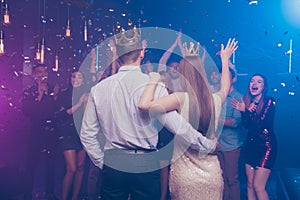 Back side view portrait of lovers have become king queen celebrating scream buddies enjoy dance floor