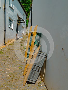 Back street in Clovelly Devon with sledges