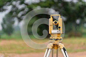 Back of Surveyors equipment theodolite or total positioning station on the construction site of the road or building with