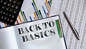 BACK TO BASIC memo written on a notebook with pen and chart