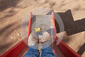 Back to the childhood, memories, feet women on the playground