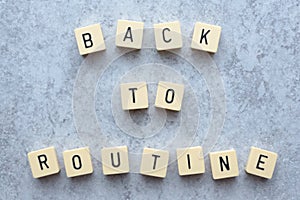 Back to routine text Game tiles on grey flecked stone background