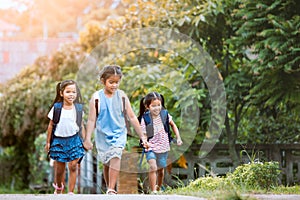 Asian pupil kids with backpack going to school