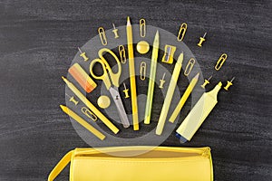 Back to school autumn concept. Top above overhead view photo of set falling yellow stationery and pencil box isolated on